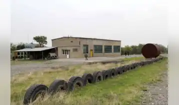 Renting 34998 km area at Tbilisi-Rustavi highway. There is a building on the area, which was used as a garage (400 km); it also has an office space, electricity, bathroom with shower. The area is fenced; gas can be provided on demand.