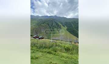 (Auto Translate!) 854 m2 plot of land for immediate sale in Kazbeg, Stepantsminda township, in a populated place, there are amazing views around, it is an ideal environment for hotels and cottages.